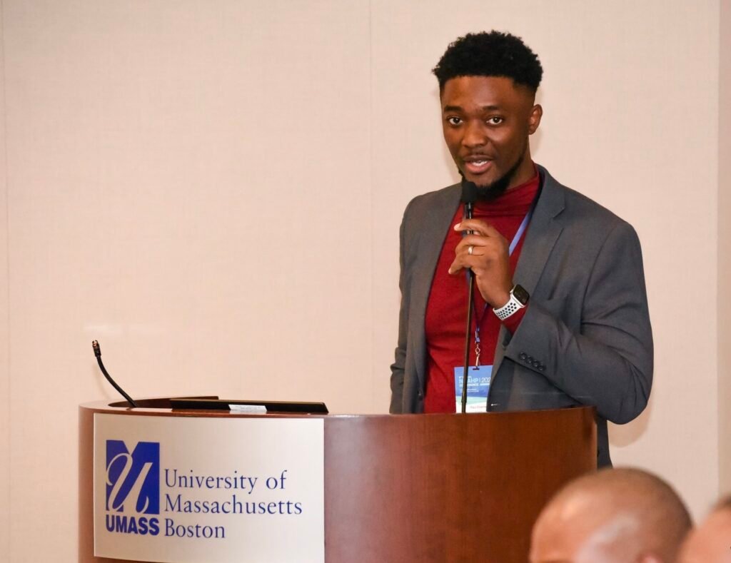 Dr. Paul Etienne speaking at the University of Massachusetts Boston